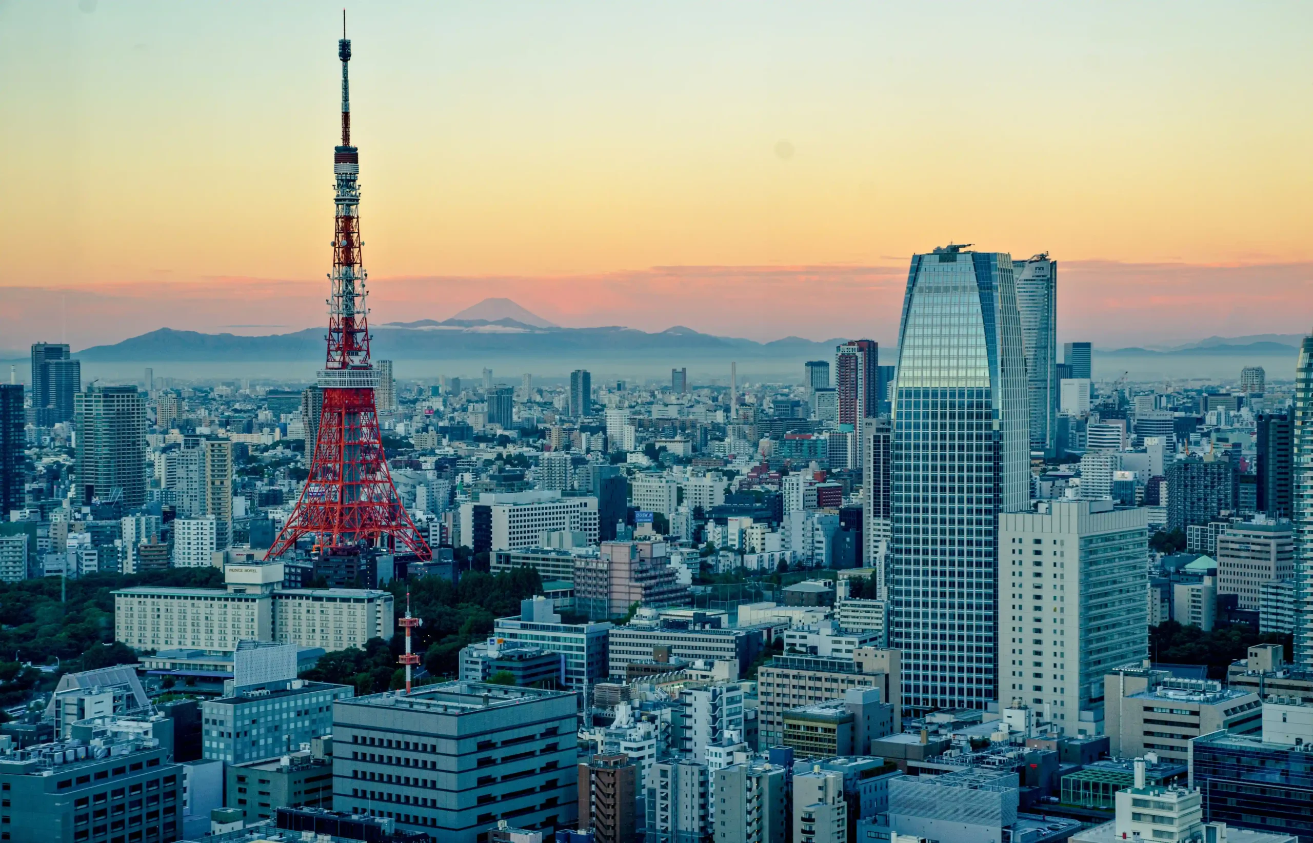 Tokyo skyline featuring the Tokyo Tower and Mount Fuji in the distance